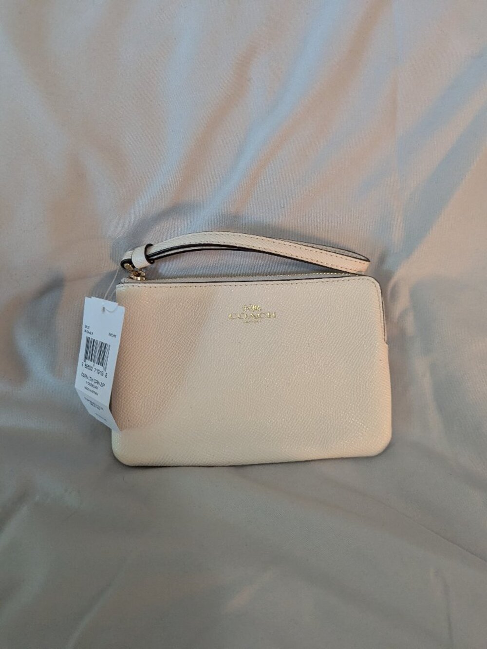White COACH wristlet